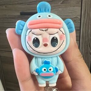 Labubu hangyodon badge reel